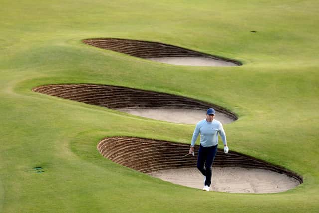 Rory McIlroy of Northern Ireland got in trouble in a bunker on the 18th hole on Day One of The 151st Open at Royal Liverpool Golf Club (Picture: Warren Little/Getty Images)