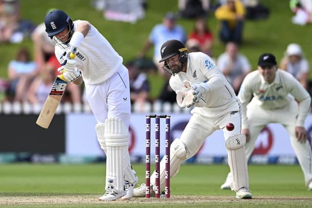 JUST SHORT: England's Joe Root, left, bats in front of New Zealand's Tom Blundell on day 5 in Wellington Picture: Andrew Cornaga/Photosport via AP