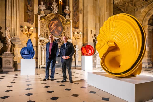 The Honourable Nicholas Howard the current custodian of Castle Howard with Sir Tony Cragg, acclaimed British-born sculptor, who is having a major exhibition at Castle Howard, next to three of Tony's works (left) McCormack: Bronze, 2007, (centre) Red Square: Bronze, 2015, and (right) Outspan:Bronze, 2008. Picture By Yorkshire Post Photographer,  James Hardisty. Date: