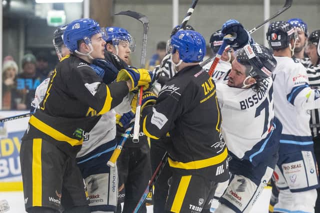 COMING TOGETHER: Leeds Knights' Jordan Griffin (left) and Sheffield Steeldogs Matt Bissonnette grapple near the Knights' net. Picture: Bruce Rollinson