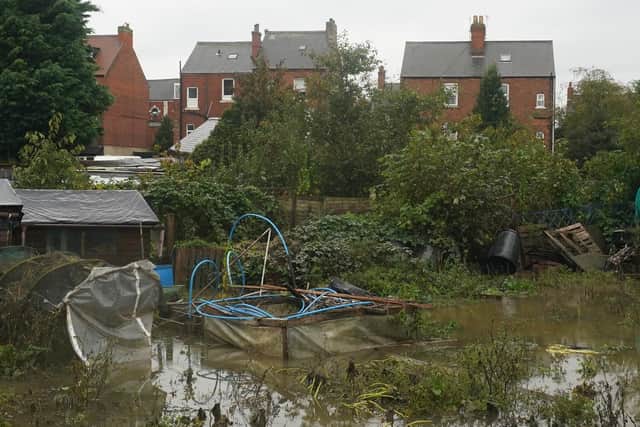 Debris and flood water in allotments after Storm Babet passed through the area. PIC: Jacob King/PA Wire