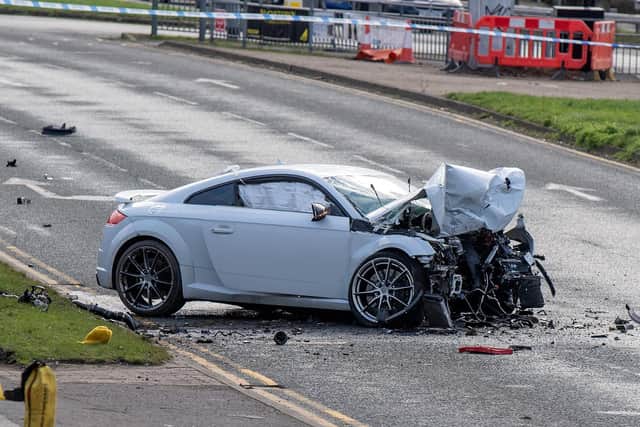 Police on the scene of a crash on Scott Hall Road outside the Vertu Jaguar Land Rover dealer involving an Audi TT.