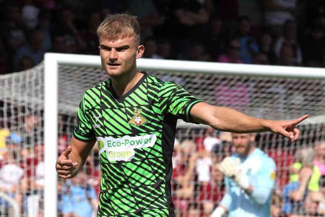 NORTHAMPTON, ENGLAND - AUGUST 27: George Miller of Doncaster Rovers in action during the Sky Bet League Two between Northampton Town and Doncaster Rovers at Sixfields on August 27, 2022 in Northampton, England. (Photo by Pete Norton/Getty Images)