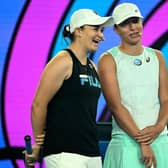 Retired former world number one Australian tennis player Ashleigh Barty (L) and Poland's Iga Swiatek attend an event of 'Kids Tennis Day' ahead of the Australian Open tennis tournament in Melbourne (Picture: WILLIAM WEST/AFP via Getty Images)