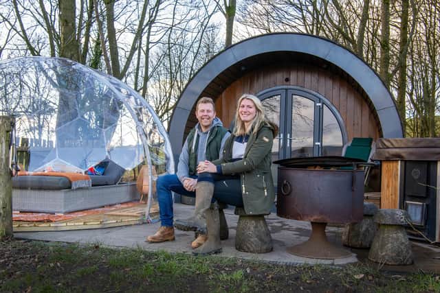 Cat & Oliver Barker by one of their camping pods at Catgill Farm Camping & Glamping at Bolton Abbey