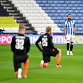 STANCE: Everton players take the knee ahead of last season's League Cup second round match at Huddersfield Town