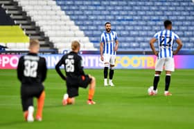 STANCE: Everton players take the knee ahead of last season's League Cup second round match at Huddersfield Town