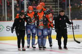 BIG BLOW: Sheffield Steelers' forward Mikko Juusola (second left) is escorted from the ice by team-mates and medical staff after taking a hit during the 6-3 win over Elite League rivals Fife Flyers on Sunday evening. Picture: Hayley Roberts/Steelers Media.