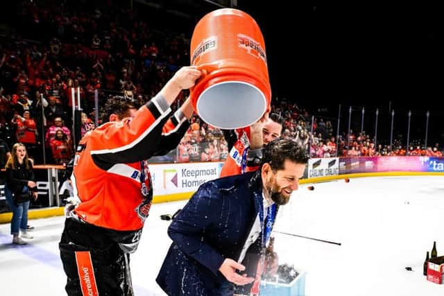 PARTY TIME: Sheffield Steelers head coach Aaron Fox, gets a dousing from his players after winning the Elite League regular season title. Picture: Dean Woolley/Steelers Media.