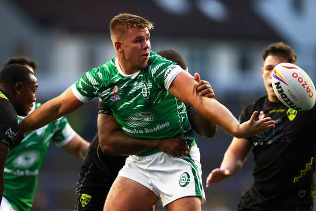 Harry Rushton of Ireland offloads the ball at Headingley. (Photo by Michael Steele/Getty Images)