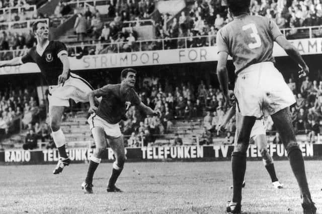 TALISMAN:  John Charles (left) playing for Wales against Mexico in the World Cup group match in Stockholm, in a 1-1 draw