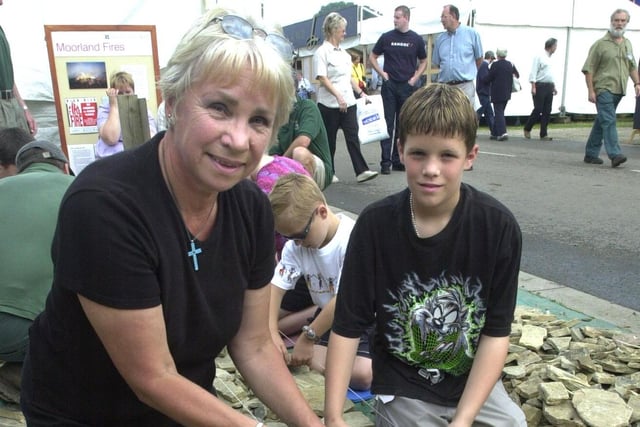 Gill Watson from Baslow and her grandson, Luke Walton, aged 12 from Chesterfield try their hand at dry stone walling at the National Trust stand of bakewell Show in 2002.