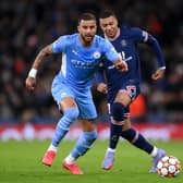 MANCHESTER, ENGLAND - NOVEMBER 24: Kyle Walker of Manchester City runs with the ball under pressure from Kylian Mbappe of Paris Saint-Germain during the UEFA Champions League group A match between Manchester City and Paris Saint-Germain at Etihad Stadium on November 24, 2021 in Manchester, England. (Photo by Laurence Griffiths/Getty Images)