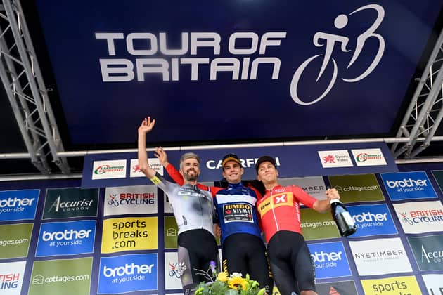 Jumbo-Visma's Wout van Aert (centre), Uno-X Pro Cycling Team's Tobias Johannessen (right), and Q36.5 Pro Cycling Team's Damien Howson finishing in gold, silver and bronze respectively celebrate following stage eight of the 2023 Tour of Britain, from Margam Country Park to Caerphilly. Picture date: Sunday September 10, 2023. Simon Galloway/PA Wire.