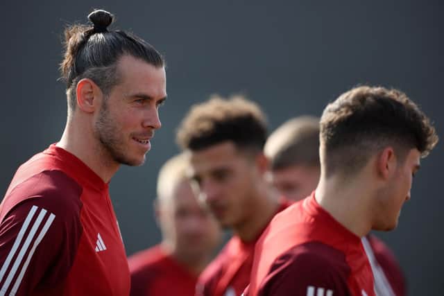 Wales' forward Gareth Bale (L) looks on during a training session at the Al Saad SC in Doha on November 20, 2022, on the eve of the Qatar 2022 World Cup football match between the USA and Wales. (Photo by ADRIAN DENNIS/AFP via Getty Images)