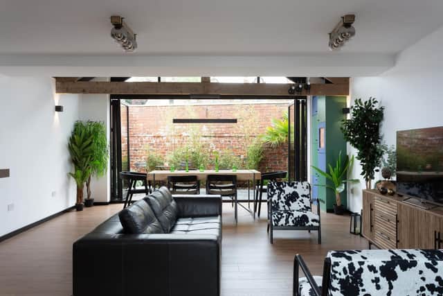 The living room features bifold doors to the outside space. Picture supplied by Prime Residential