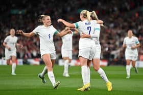 LONDON, ENGLAND - OCTOBER 07: Lauren Hemp of England celebrates with teammate Beth Mead and Georgia Stanway after scoring their team's first goal during the Women's International Friendly match between England and USA at Wembley Stadium on October 07, 2022 in London, England. (Photo by Justin Setterfield/Getty Images)