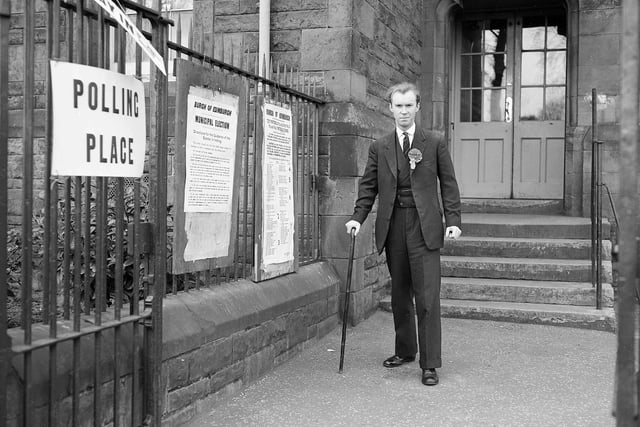 Nicholas Fairbairn, a municipal election candidate for Liberton, leaves the polling station after recording his vote in May 1960.