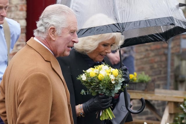 King Charles III and the Queen Consort during their visit to Talbot Yard Food Court in Yorkersgate, Malton, North Yorkshire, where they met food and drink producers with shops and heard more about their locally produced goods. Picture date: Wednesday April 5, 2023.
