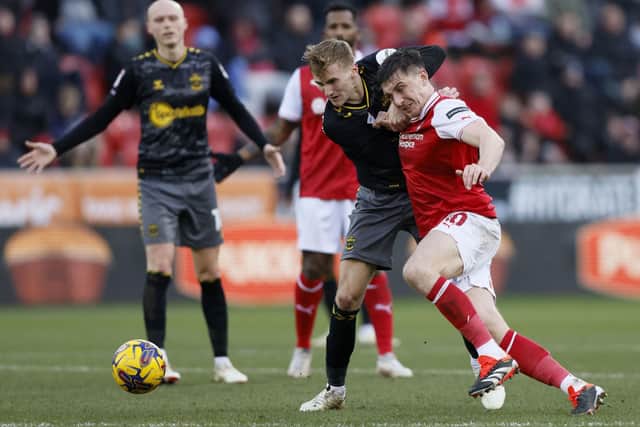 HARD_FOUGHT: Rotherham United's Jordan Hugill and Southampton's Flynn Downes battle for the ball at the Aesseal New York Stadium, Rotherham. Picture: Richard Sellers/PA