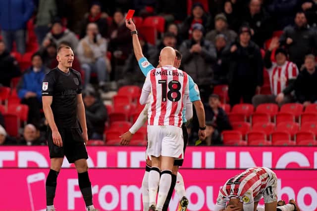 ON YOUR WAY SON: Huddersfield Town's Will Boyle is shown a red card at the bet365 Stadium. Picture: Mike Egerton/PA