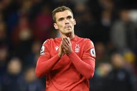 NOTTINGHAM, ENGLAND - OCTOBER 10: Harry Toffolo of Nottingham Forest applauds the fans after the Premier League match between Nottingham Forest and Aston Villa at City Ground on October 10, 2022 in Nottingham, England. (Photo by Michael Regan/Getty Images)