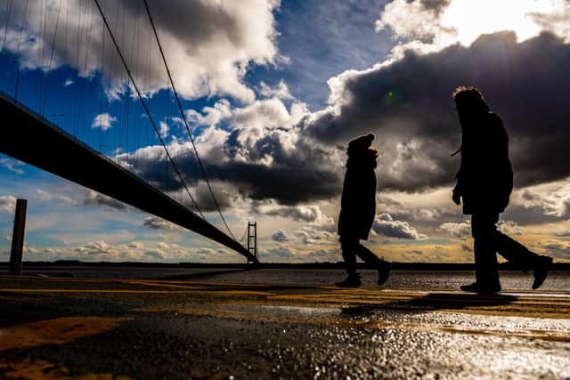 Groups of walkers brave the cold and take a stroll along the Hessle Foreshore walk taking in great views over the Humber and the iconic Humber Bridge.  Picture By Yorkshire Post Photographer,  James Hardisty. Date: 14th March 2023.