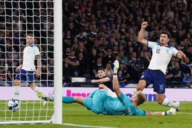 BAD LUCK: England’s Harry Maguire scores an own goal past goalkeeper Aaron Ramsdale at Hampden Park on Tuesday night Picture: Andrew Milligan/PA