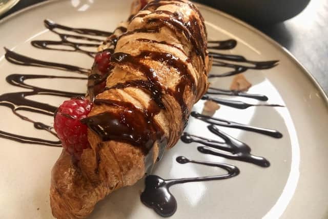 Croissant stuffed with raspberries and Nutella chocolate.
