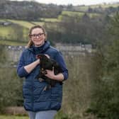 Rebecca Robson with a copper black maran cross with black bantams heritage breed chicken in Holmfirth