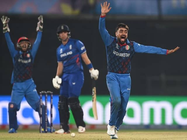 Out: Afghanistan’s Rashid Khan celebrates the wicket of England’s Liam Livingstone during the ICC Men’s Cricket World Cup in Delhi, India. (Photo by Gareth Copley/Getty Images)
