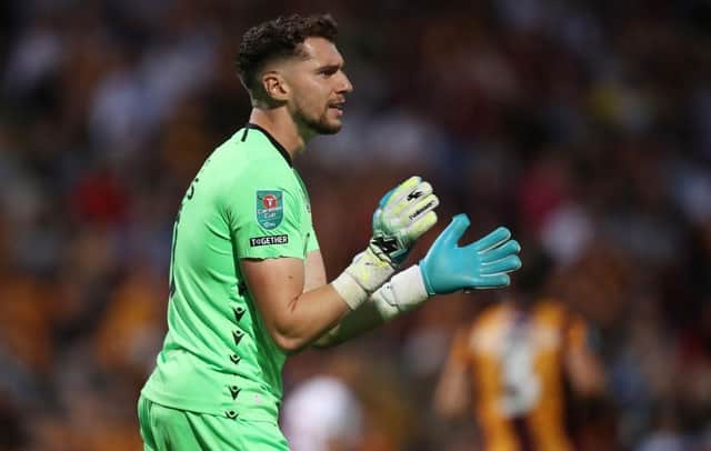 BRADFORD, ENGLAND - AUGUST 09: Harry Lewis of Bradford City applauds during the Carabao Cup First Round match between Bradford City and Hull City at University of Bradford Stadium on August 09, 2022 in Bradford, England. (Photo by George Wood/Getty Images):d