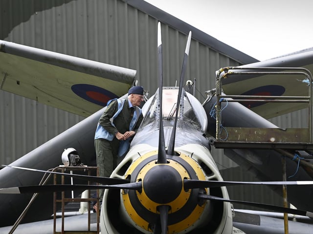 Volunteer John Best talks a visitor through the Fairey Gannet AEW3, during the open cockpit event at the Yorkshire Air Museum, near York.