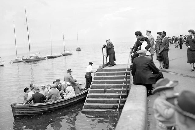 Passengers board the Cramond Ferry in 1958.