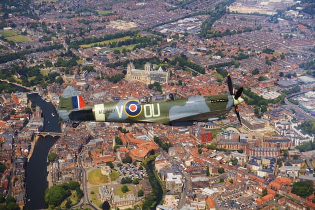 The Spitfire is pictured flying over York Minster. Picture taken by Yorkshire Post Photographer Simon Hulme.