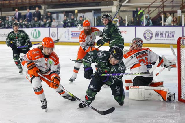 UNDER PRESSURE: Sheffield Steelers' defenceman Brien Diffley (left) battles for puck possession around the visitors' net. Picture courtesy of Mark Ferris/EIHL Media.