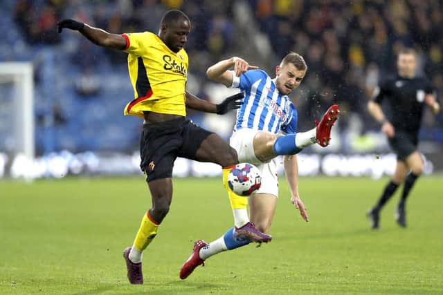 Watford's Ismaila Sarr (left) and Huddersfield Town's Michal Helik battle for the ball during the Sky Bet Championship match at John Smith's Stadium, Huddersfield. Picture: Will Matthews/PA Wire.