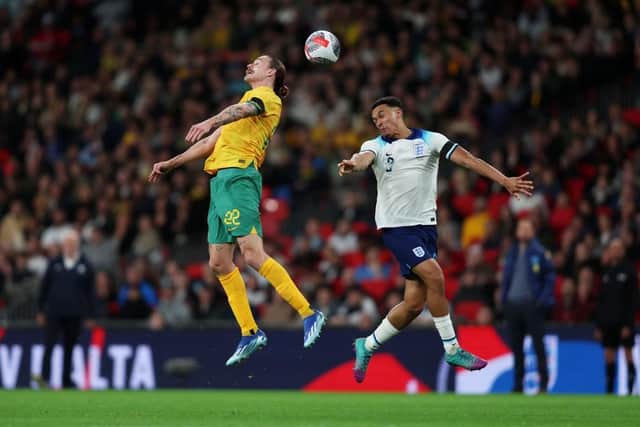 SHAPE-SHIFTER: Trent Alexander-Arnold, who did two jobs for England, competes for the ball with former Hull City midfielder Jackson Irvine