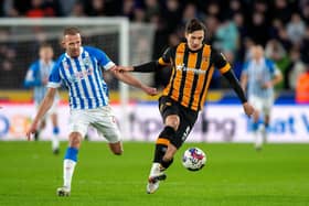 Alfie Jones holds off Jordan Rhodes in Hull City's match with Huddersfield Town in January. Picture: Bruce Rollinson