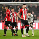 FRAGILE: Sheffield United's shell-shocked players in the 6-0 defeat to Arsenal