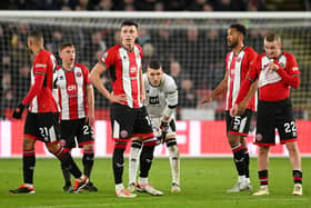 FRAGILE: Sheffield United's shell-shocked players in the 6-0 defeat to Arsenal