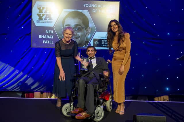 Yorkshire Asian Young Achiever of the Year 2022 Neil Bharat Patel (centre) receiving his award from Professor Karen Bryan, vice-chancellor of York St John University (left), with YAYAs host Noreen Khan (right). Credit: Roger Moody.
