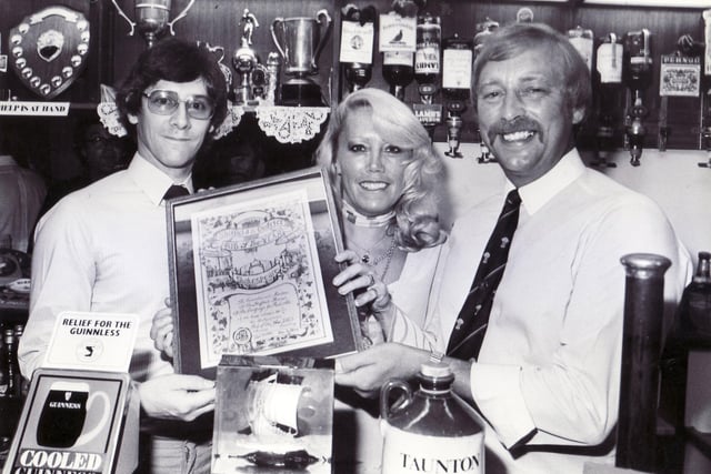Mike Hensman, left, chairman of Sheffield CAMRA, making the presentation of the Pub of the Year trophy to Ray and Chris Finlay of the Shakespeare, Gibraltar Street, Sheffield in July 1983
