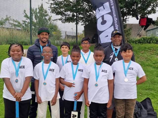 Community game: Andre Jackson and pupils of the ACE cricketing programme in South Yorkshire.