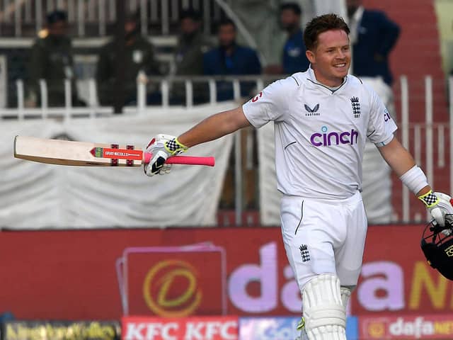 England's Ollie Pope celebrates after scoring a century (100 runs) during the first day of the first cricket Test match between Pakistan and England at the Rawalpindi Cricket Stadium (Picture: AAMIR QURESHI/AFP via Getty Images)