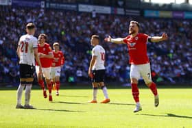 BOLTON, ENGLAND - MAY 13: Nicky Cadden of Barnsley celebrates after scoring the team's first goal during the Sky Bet League One Play-Off Semi-Final First Leg match between Bolton Wanderers and Barnsley at University of Bolton Stadium on May 13, 2023 in Bolton, England. (Photo by Michael Steele/Getty Images)