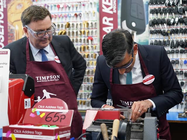 Work and Pensions Secretary Mel Stride (left) and Prime Minister Rishi Sunak during a visit to a branch of Timpson. PIC: Yui Mok/PA Wire
