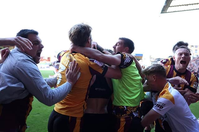 SAVING GRACE: Bradford City players and celebrate Antoni Sarcevic's historic winner against Fleetwood Town (Image: George Wood/Getty Images)