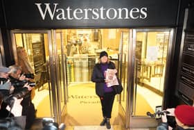 Caroline Lennon, the first customer to purchase a copy of Spare, the newly released autobiography from the Duke of Sussex, poses for photographers with her copy of the book as she leaves Waterstones Piccadilly, London. PIC: James Manning/PA Wire