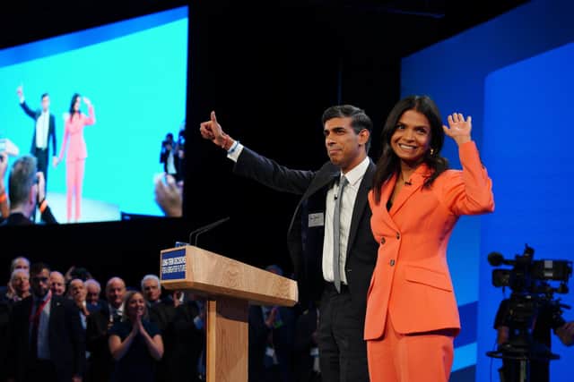Rishi Sunak with his wife Akshata Murty on stage at the end of his keynote speech during the Conservative Party annual conference at the Manchester Central convention complex.